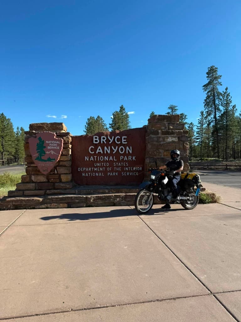Rider at Bryce Canyon National Park entrance sign