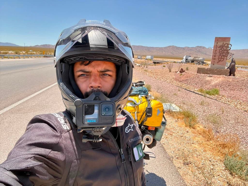 Rider at the California state welcome sign