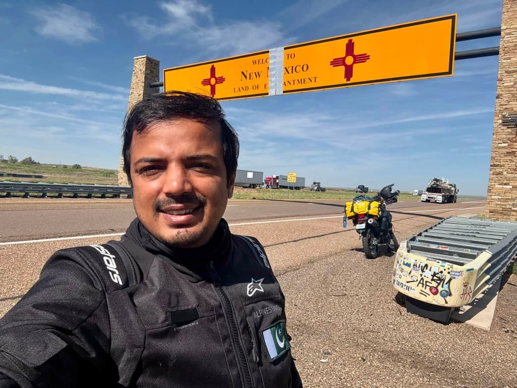 New Mexico welcome sign with loaded DR650