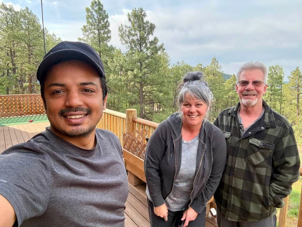 Human connection on a forest deck with hosts
