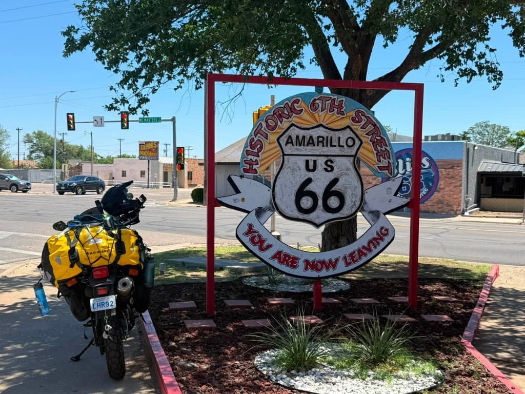 Route 66 leaving Amarillo sign with adventure motorcycle