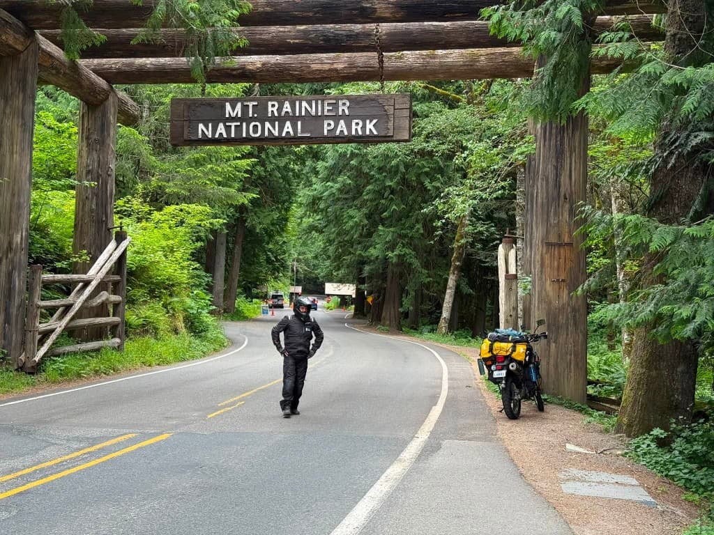 Rider at Mt. Rainier National Park entrance arch
